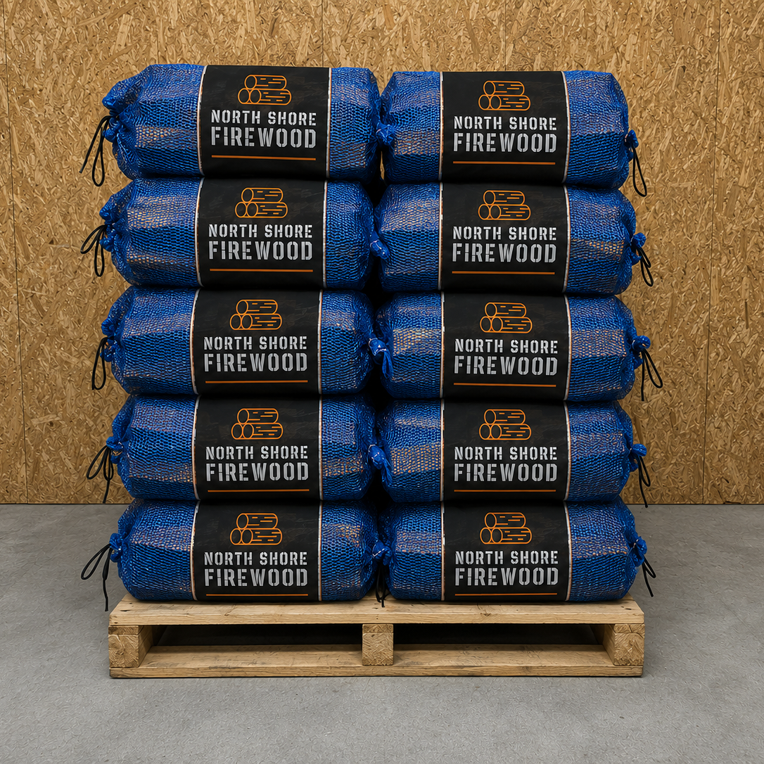 Stack of North Shore Firewood ash netson a wooden pallet against a wooden wall.