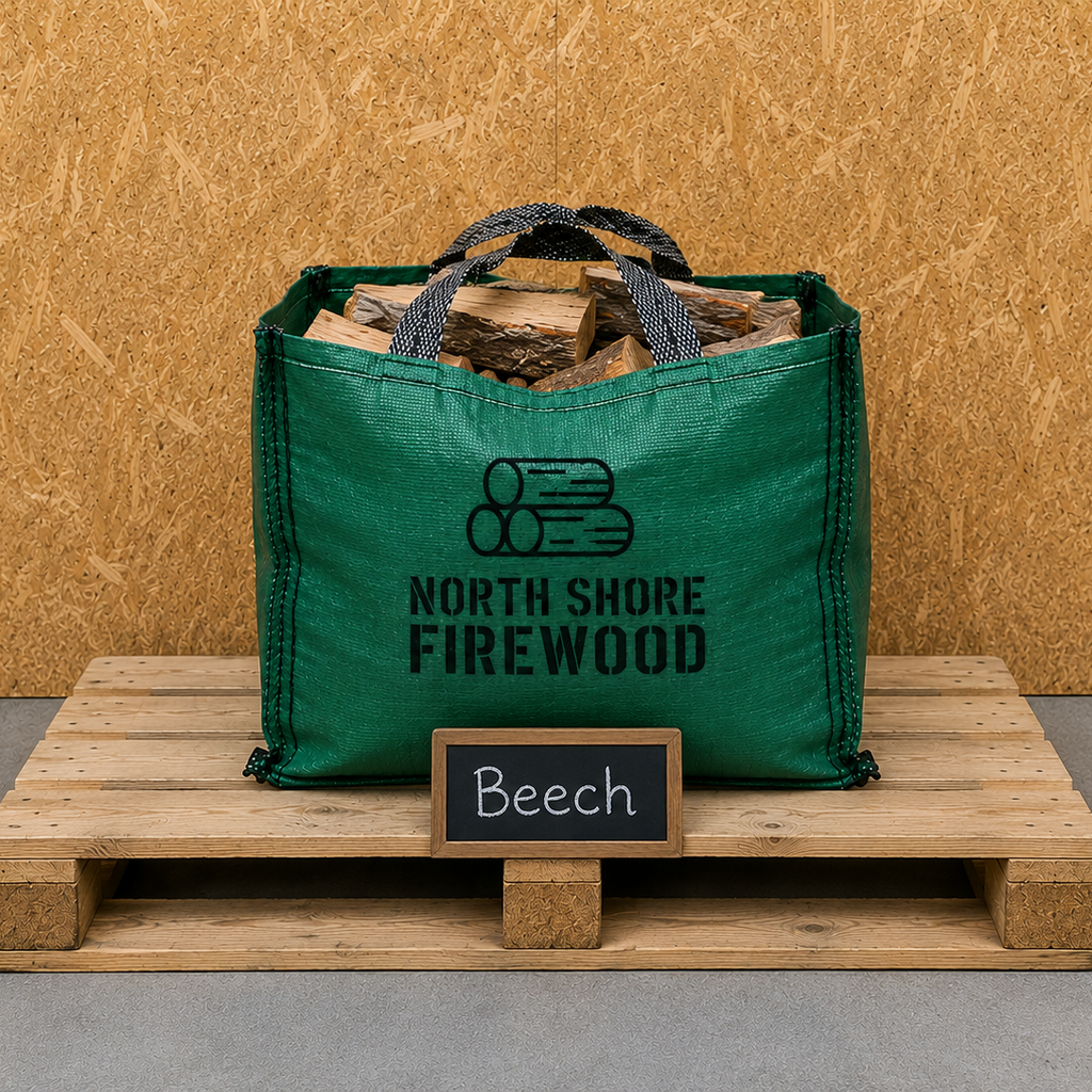 Green bag of firewood labeled 'North Shore Firewood' on a wooden pallet with a 'Beech' sign.