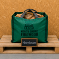 Green bag of firewood with 'North Shore Firewood' branding on a wooden pallet.