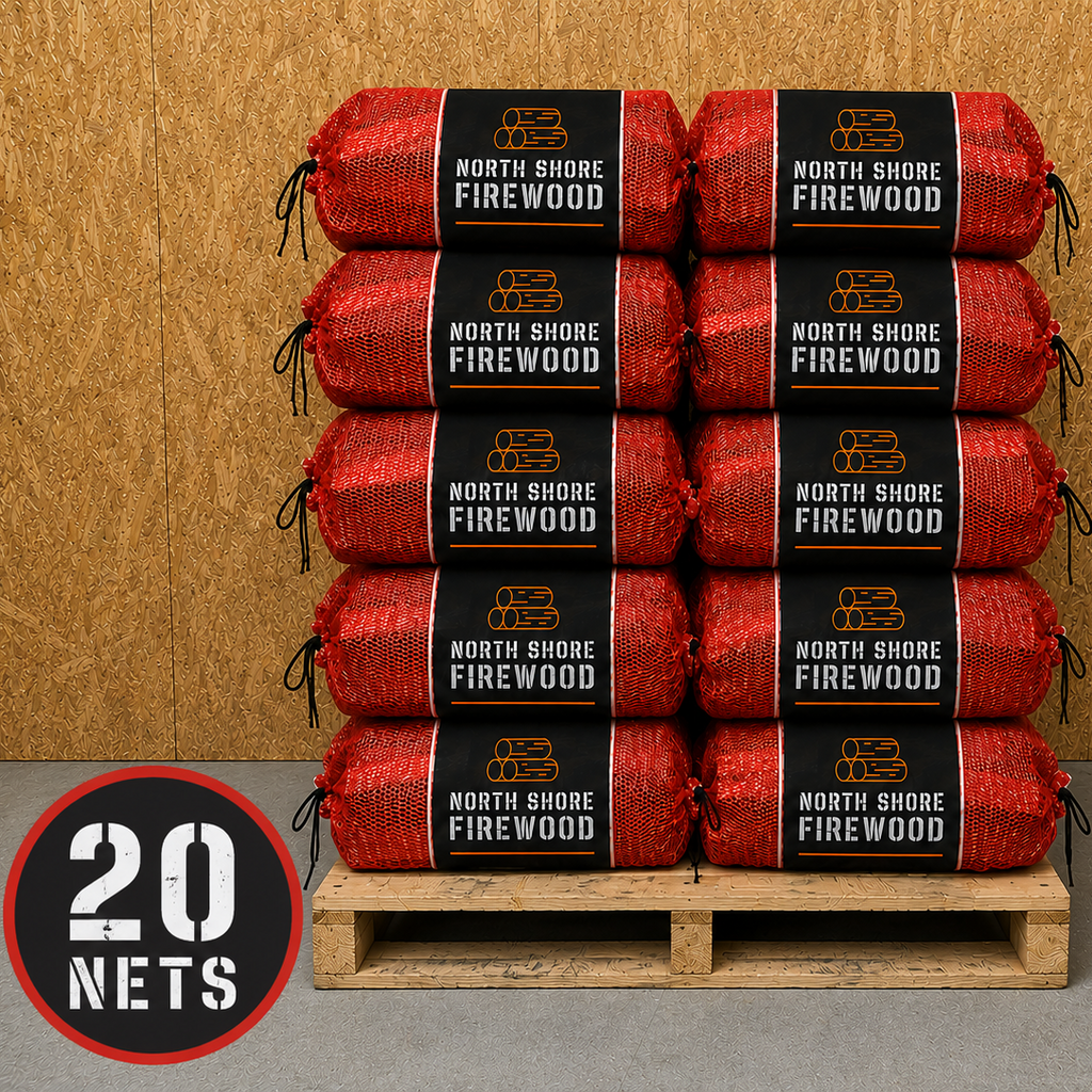 Stack of North Shore Firewood rolls on a wooden pallet with a wooden wall background.