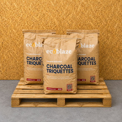 Three bags of ecoblaze Charcoal Triquettes on a wooden pallet with a wooden background.