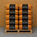 Stack of North Shore Firewood packages on a wooden pallet against a brown background