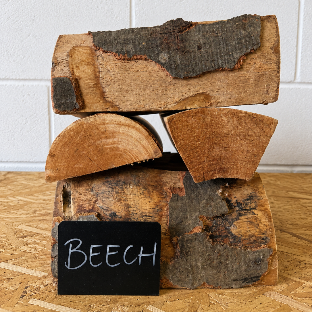 Stack of firewood with a 'BEECH' label on a wooden surface.