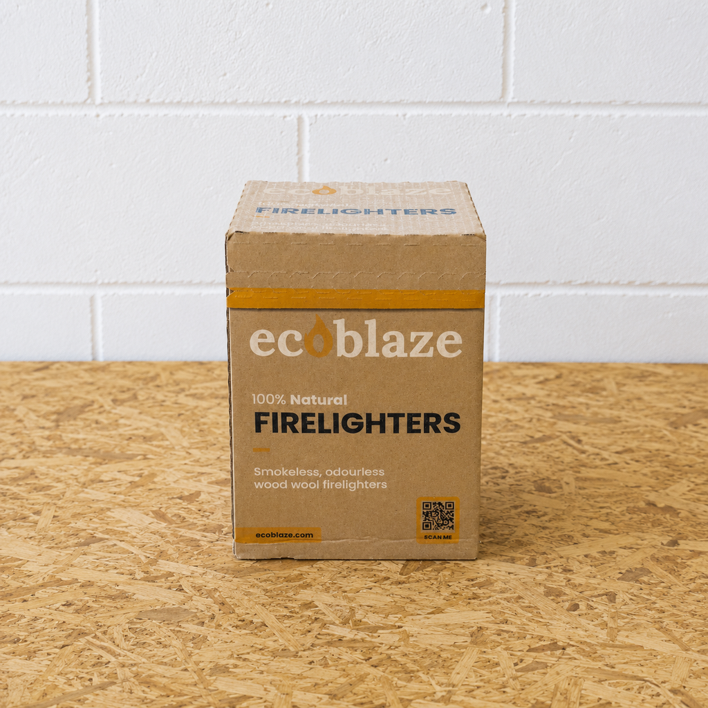 Box of ecoblaze firelighters on a wooden surface with a white tiled wall background