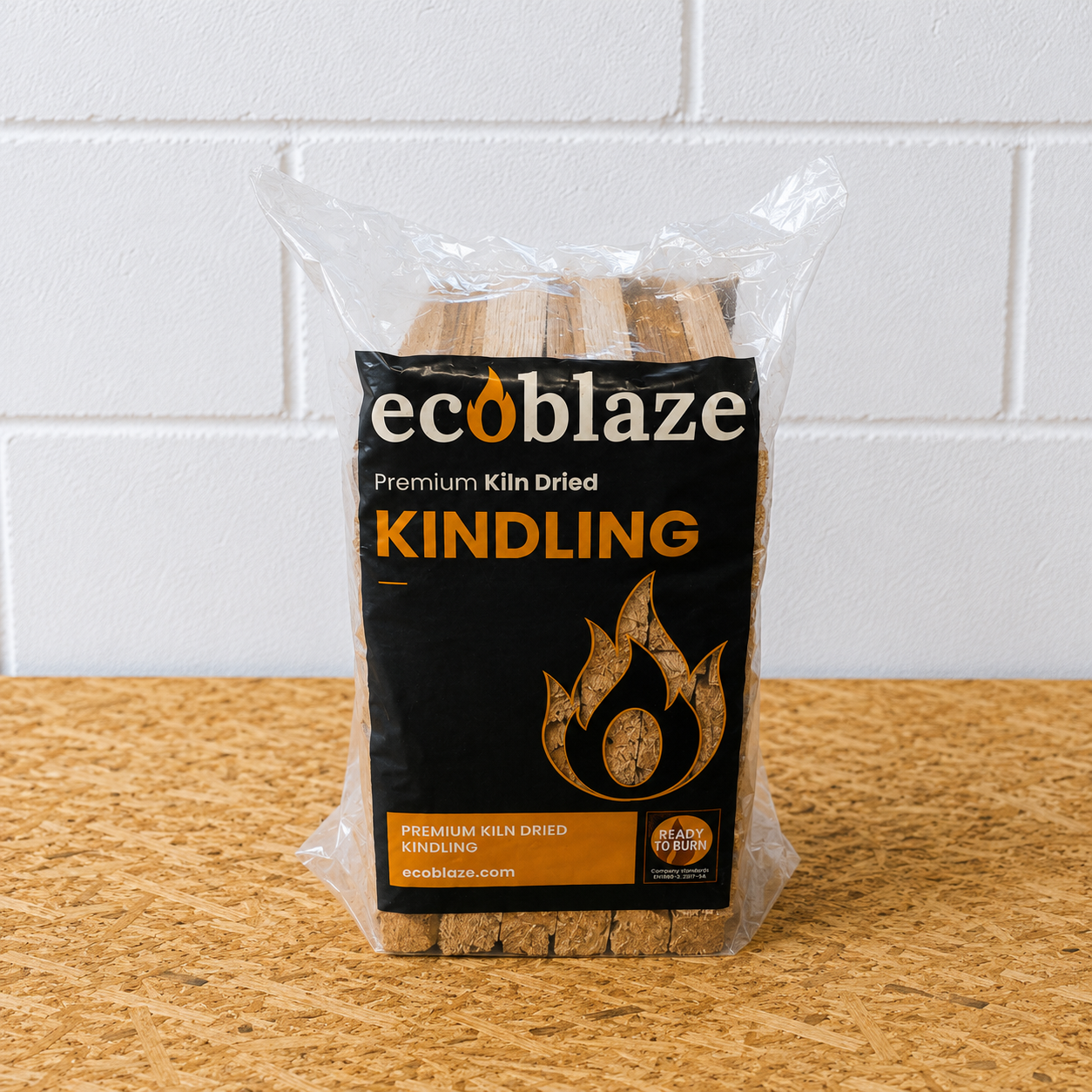 Bag of ecoblaze kindling on a wooden surface with a white tiled wall background